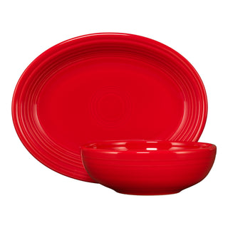 A Fiesta 2-Piece Serve Set in scarlet, including an 11 5/8" oval platter and a 38 oz Bistro bowl, is shown on a white background. Both feature a glossy finish and embossed concentric circles near the edges.