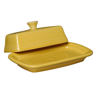 The Fiesta Retired Extra Large Covered Butter Dish in sunflower is 8 1/8 x 5 1/8 inches, featuring a rectangular ceramic base and matching knob-handled lid. Made in the USA from lead-safe china.