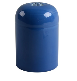 The Retired Fiesta Cheese Shaker by Fiesta is a hand-finished, chip-resistant blue ceramic shaker with a rounded top and multiple small holes, shown on a white background.