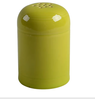 The Retired Fiesta Cheese Shaker by Fiesta, in lemongrass yellow, features a rounded top with small holes. Hand-finished and chip resistant, it's ideal for dispensing spices. Shown set against a white background.