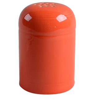 The Retired Fiesta Cheese Shaker by Fiesta features a hand-finished, chip-resistant Poppy orange design with a rounded top and small holes, shown against a plain white background.